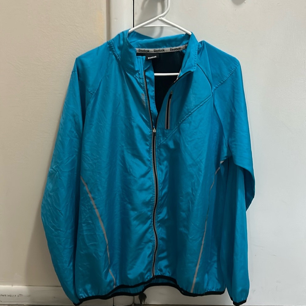 Women’s medium-large blue Reebok wind breaker